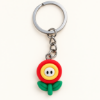 Imagem de Chaveiro Flor Vermelha Estilo Mario Bros – Acessório Geek Kawaii Gamer para Chaves, Bolsas e Mochilas